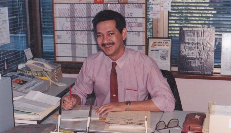 Ronald Jan sitting at this desk. 