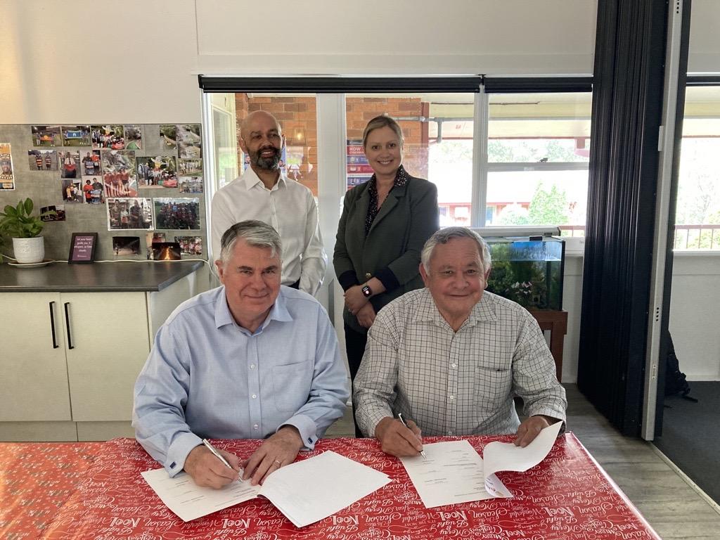 AHL CEO Dave Chalmers (front left) and Aboriginal Children’s Advancement Society President,  Ivan Simon PSM, sign our Memorandum of Understanding at Kirinari Sylvania Hostel, with  Anthony Ashby and Katie Wyatt standing behind.