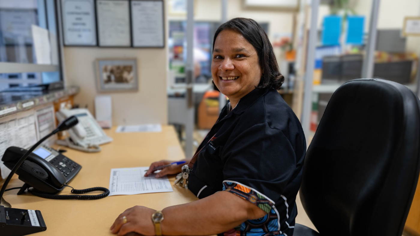 AHL staff member sitting at desk 